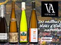 Quatre bouteilles de vin d'Alsace, dont un meilleur pinot gris, sur fond de vignobles.