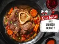 Un osso bucco savoureux, garni de carottes et de tomates, servi avec un verre de vin rouge. Que boire avec un osso bucco ?