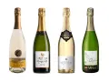 Quatre bouteilles de Clairette de Die, dont une cuvée blanche et trois en bouteilles vertes, prêtes à être dégustées.