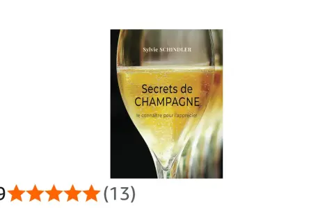Couverture du livre "Secrets de CHAMPAGNE" de Sylvie Schindler, avec un verre de champagne pétillant. Le livre explore les secrets de ce cépage champenois.