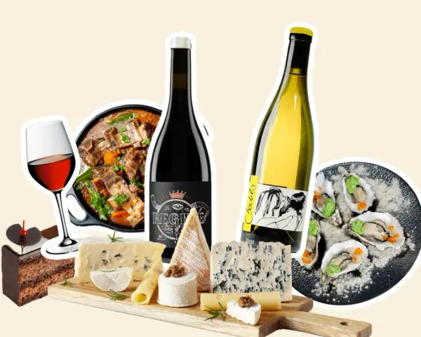 Un festin visuel : un plat mijoté, des huîtres, un gâteau au chocolat, des fromages variés et des bouteilles de vin. Un parfait accord mets vins.
