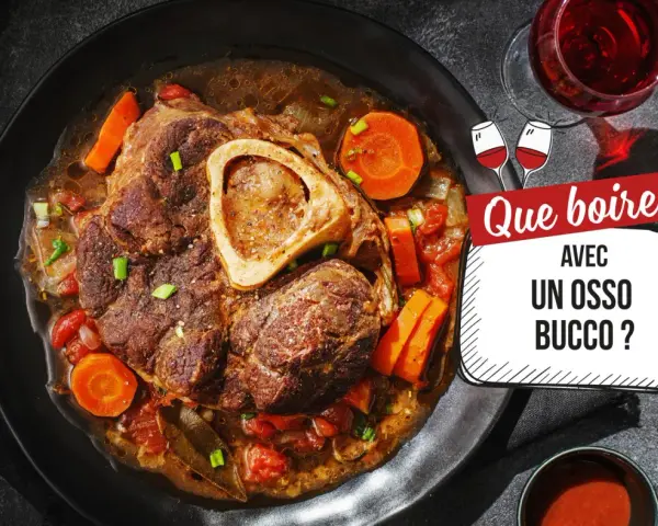 Un osso bucco savoureux, garni de carottes et de tomates, servi avec un verre de vin rouge. Que boire avec un osso bucco ?