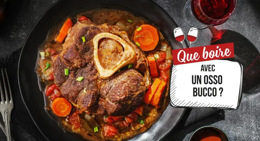 Un osso bucco savoureux, garni de carottes et de tomates, servi avec un verre de vin rouge. Que boire avec un osso bucco ?